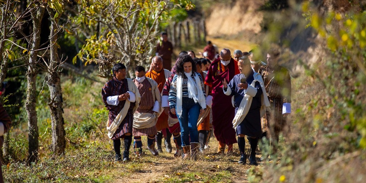 Bhutanese officials walking with donor partners from the Green Climate Fund