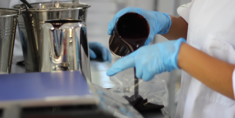 Producing açaí juice from açaí berries.