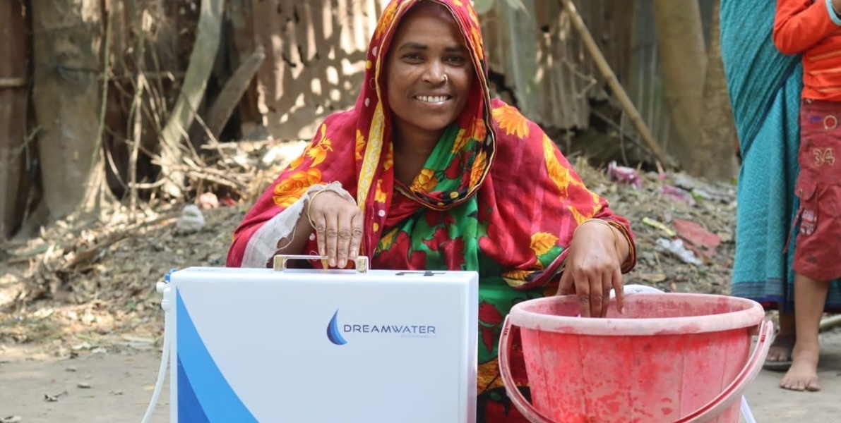 Woman poses with the Dreamwater filter in Bangladesh