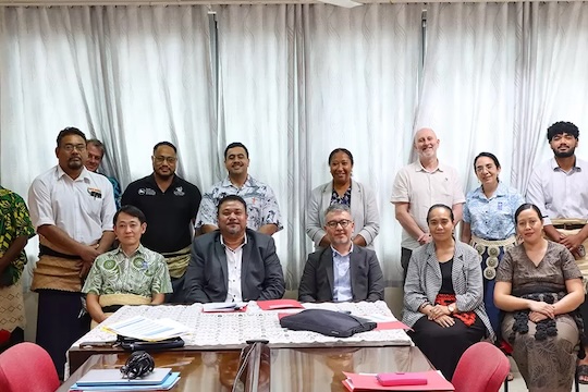 Participants pose for a photo at the project board meeting. 